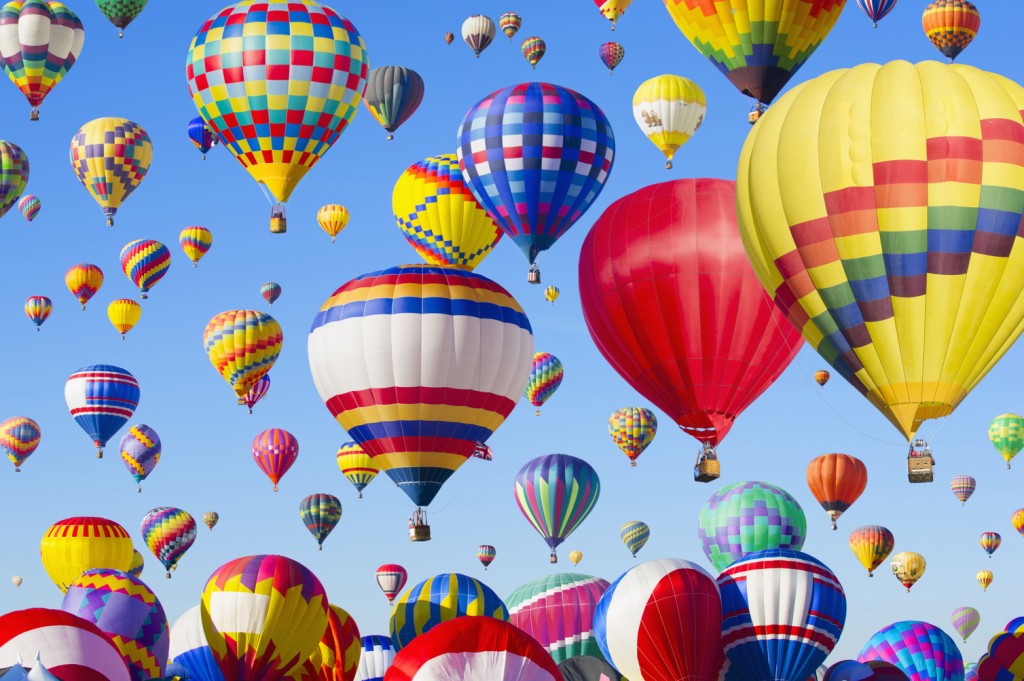 Hot air balloons floating in blue sky